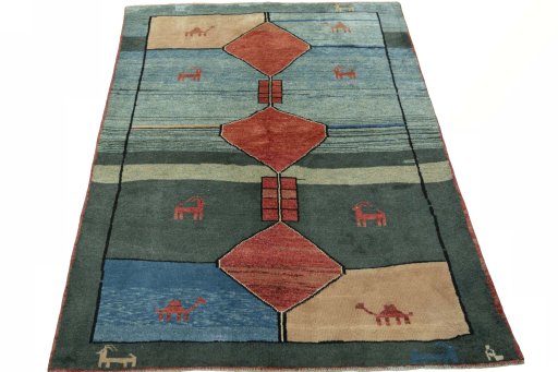 Surface texture of 2000s Persian Gabbeh rug with natural Wool and intricate pattern