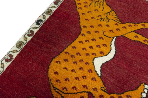 Backside of handmade 2000s Persian Gabbeh rug showing knot structure and weave density