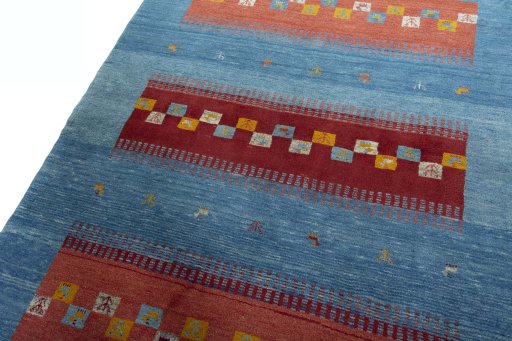 Backside of handmade New Persian Gabbeh rug showing knot structure and weave density