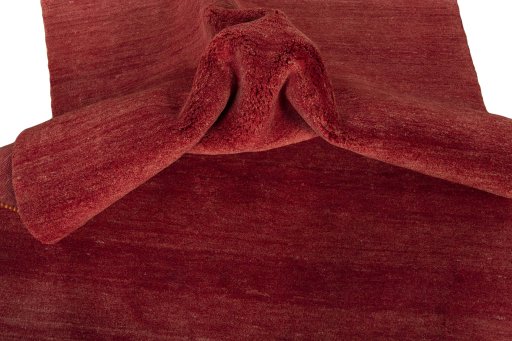 Corner detail of New Persian Gabbeh rug showing border pattern and Wool pile