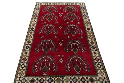 Surface texture of 2000s Persian Gabbeh rug with natural Wool and intricate pattern