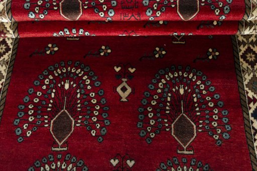 Full view of 2000s Persian Gabbeh rug from Iran / Persia, 252 × 127 cm in Red tones