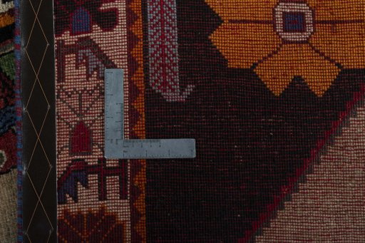 Surface texture of 2000s Persian Gabbeh rug with natural Wool and intricate pattern