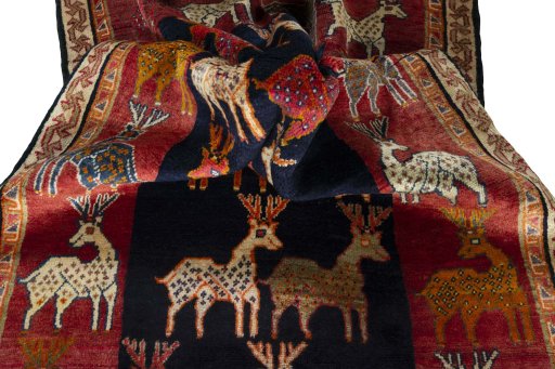 Corner detail of 2000s Persian Gabbeh rug showing border pattern and Wool pile