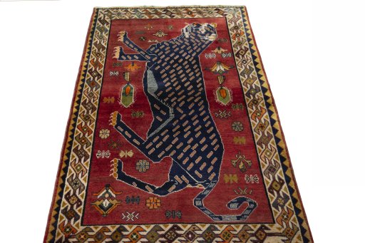 Surface texture of 2000s Persian Gabbeh rug with natural Wool and intricate pattern