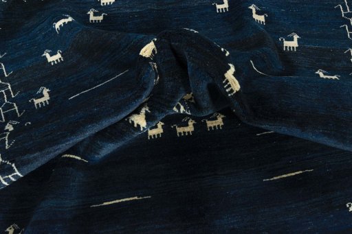 Close-up detail of 2000s Persian Gabbeh rug from Iran / Persia showing Wool weave