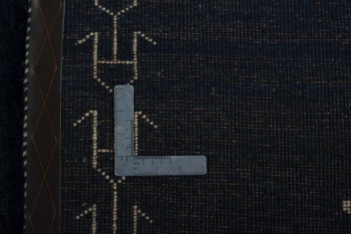 Surface texture of 2000s Persian Gabbeh rug with natural Wool and intricate pattern