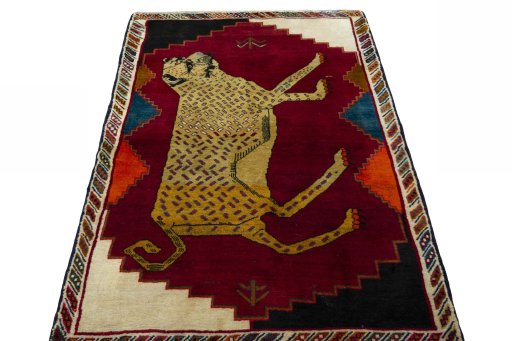 Surface texture of 2000s Persian Gabbeh rug with natural Wool and intricate pattern