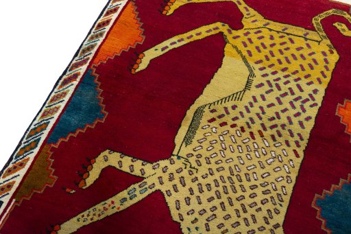 Backside of handmade 2000s Persian Gabbeh rug showing knot structure and weave density