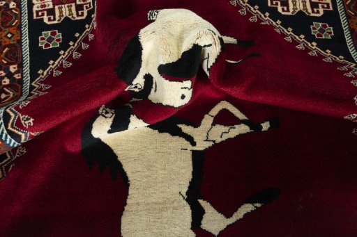 Corner detail of 2000s Persian Gabbeh rug showing border pattern and Wool pile
