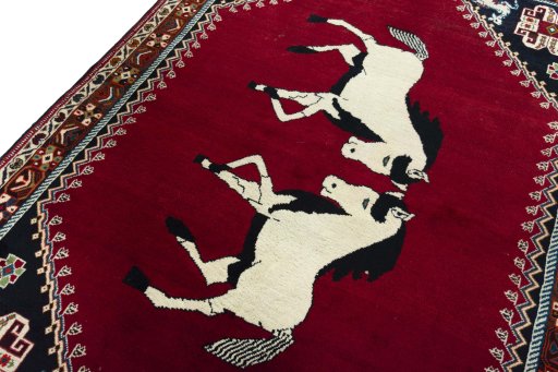 Backside of handmade 2000s Persian Gabbeh rug showing knot structure and weave density