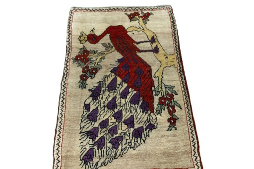 Surface texture of 2000s Persian Gabbeh rug with natural Wool and intricate pattern