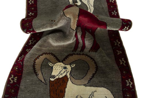 Corner detail of 2000s Persian Gabbeh rug showing border pattern and Wool pile