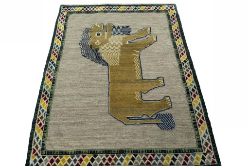 Surface texture of 2000s Persian Gabbeh rug with natural Wool and intricate pattern