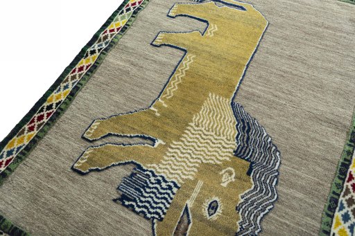 Backside of handmade 2000s Persian Gabbeh rug showing knot structure and weave density