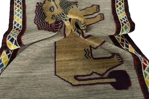 Corner detail of 2000s Persian Gabbeh rug showing border pattern and Wool pile