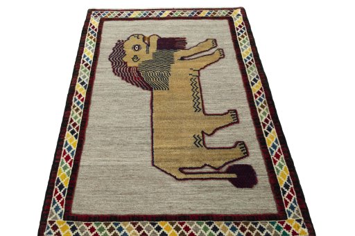 Surface texture of 2000s Persian Gabbeh rug with natural Wool and intricate pattern
