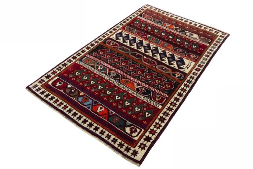 Corner detail of 2000s Persian Gabbeh rug showing border pattern and Wool pile
