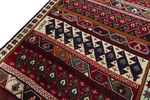 Backside of handmade 2000s Persian Gabbeh rug showing knot structure and weave density
