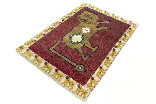 Corner detail of 2000s Persian Gabbeh rug showing border pattern and Wool pile