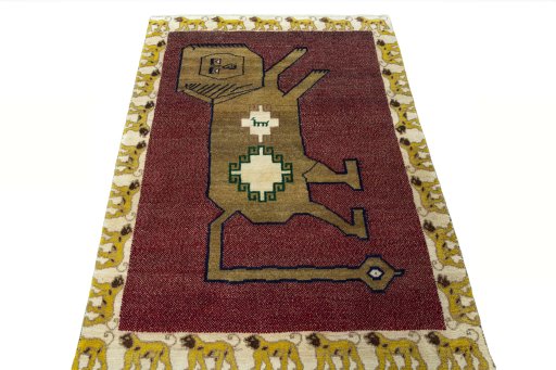Surface texture of 2000s Persian Gabbeh rug with natural Wool and intricate pattern