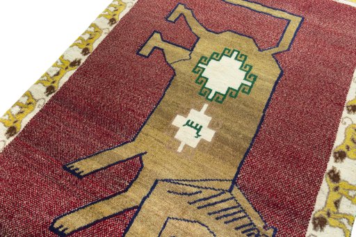 Backside of handmade 2000s Persian Gabbeh rug showing knot structure and weave density