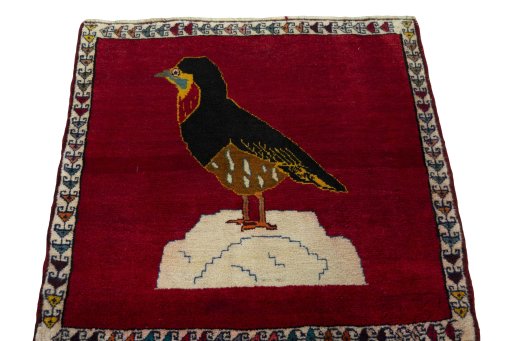 Surface texture of 2000s Persian Gabbeh rug with natural Wool and intricate pattern