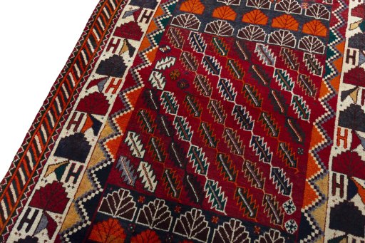 Backside of handmade 2000s Persian Gabbeh rug showing knot structure and weave density