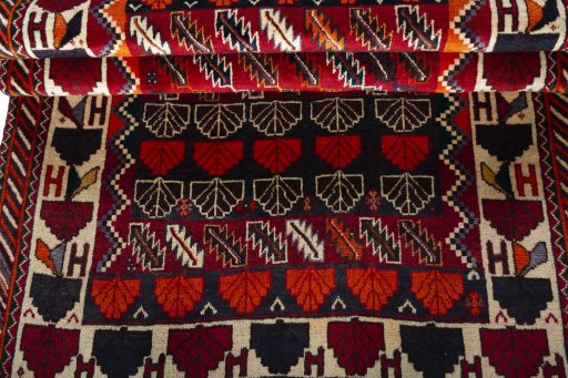 Full view of 2000s Persian Gabbeh rug from Iran / Persia, 195 × 118 cm in Red tones