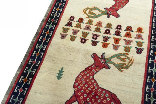 Backside of handmade 2000s Persian Gabbeh rug showing knot structure and weave density