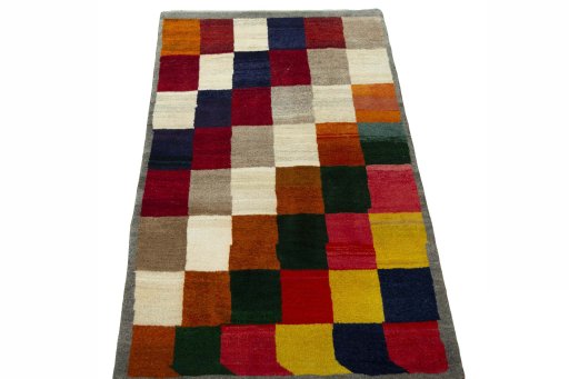 Surface texture of 2000s Persian Gabbeh rug with natural Wool and intricate pattern