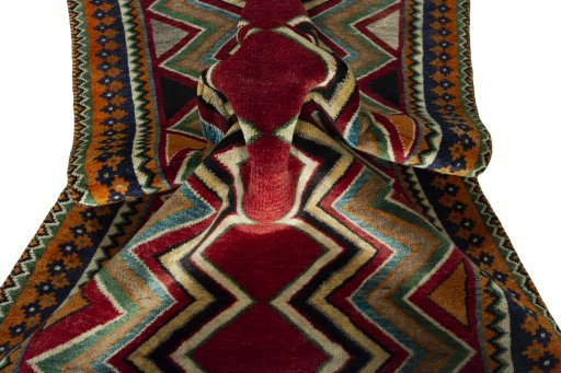 Corner detail of 2000s Persian Gabbeh rug showing border pattern and Wool pile