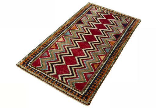 Corner detail of 2000s Persian Gabbeh rug showing border pattern and Wool pile