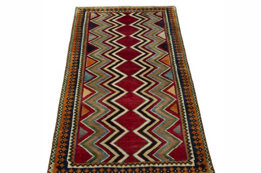 Surface texture of 2000s Persian Gabbeh rug with natural Wool and intricate pattern