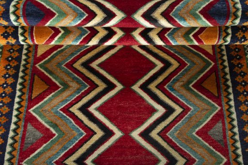 Full view of 2000s Persian Gabbeh rug from Iran / Persia, 195 × 108 cm in Red tones