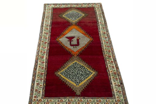 Surface texture of 2000s Persian Gabbeh rug with natural Wool and intricate pattern