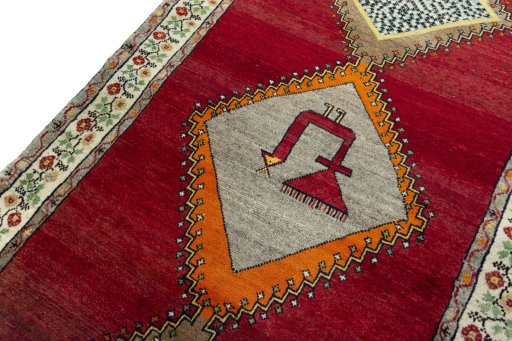 Backside of handmade 2000s Persian Gabbeh rug showing knot structure and weave density