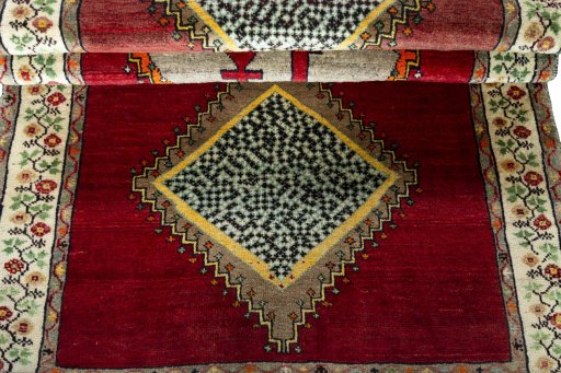Full view of 2000s Persian Gabbeh rug from Iran / Persia, 198 × 105 cm in Red tones