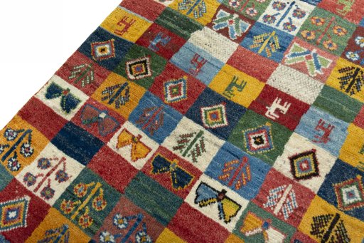 Backside of handmade New Persian Gabbeh rug showing knot structure and weave density