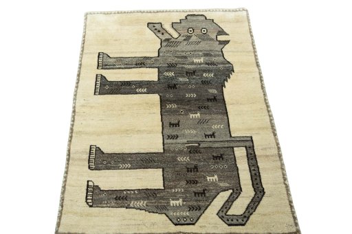 Surface texture of 2000s Persian Gabbeh rug with natural Wool and intricate pattern