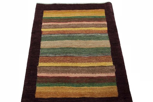 Surface texture of 2000s Persian Gabbeh rug with natural Wool and intricate pattern