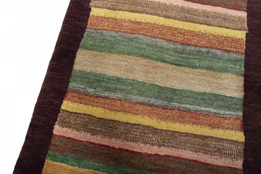 Backside of handmade 2000s Persian Gabbeh rug showing knot structure and weave density