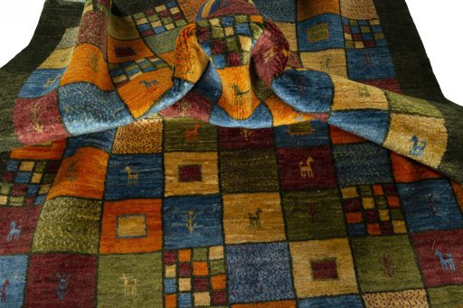 Corner detail of 2000s Persian Gabbeh rug showing border pattern and Wool pile