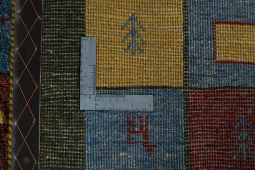 Close-up detail of 2000s Persian Gabbeh rug from Iran / Persia showing Wool weave