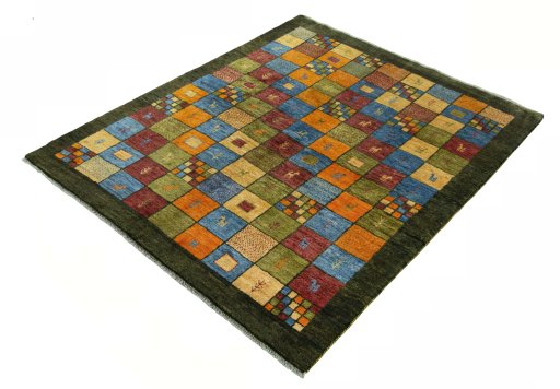 Corner detail of 2000s Persian Gabbeh rug showing border pattern and Wool pile