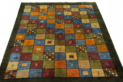 Surface texture of 2000s Persian Gabbeh rug with natural Wool and intricate pattern