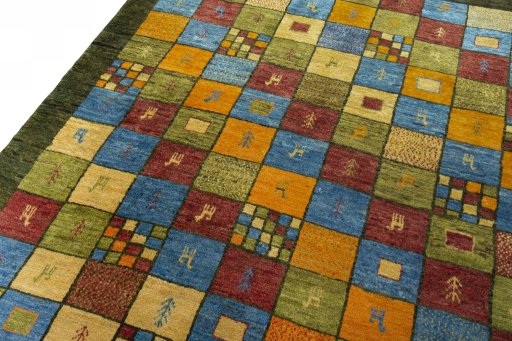 Backside of handmade 2000s Persian Gabbeh rug showing knot structure and weave density
