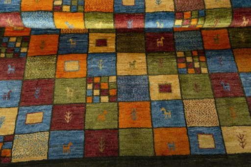 Full view of 2000s Persian Gabbeh rug from Iran / Persia, 203 × 168 cm in Green tones