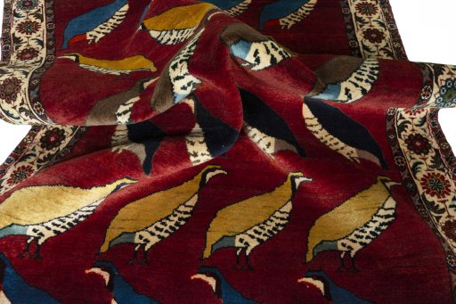 Corner detail of 2000s Persian Gabbeh rug showing border pattern and Wool pile