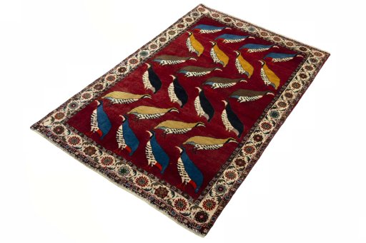 Corner detail of 2000s Persian Gabbeh rug showing border pattern and Wool pile